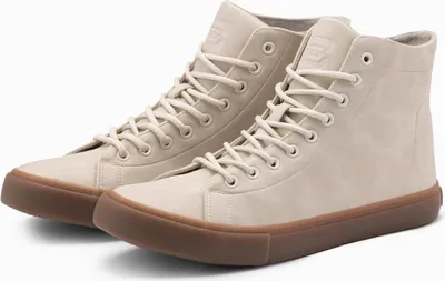 A pair of cream-colored high-top sneakers with brown soles are displayed against a white background.