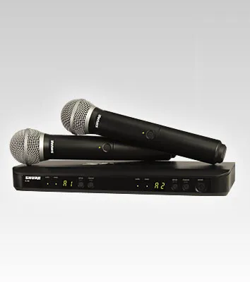 A black dual wireless microphone system with a receiver and two microphones, displayed on a light gray background.