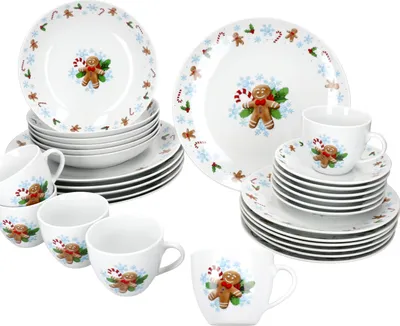 A collection of Christmas-themed dinnerware with gingerbread man designs.