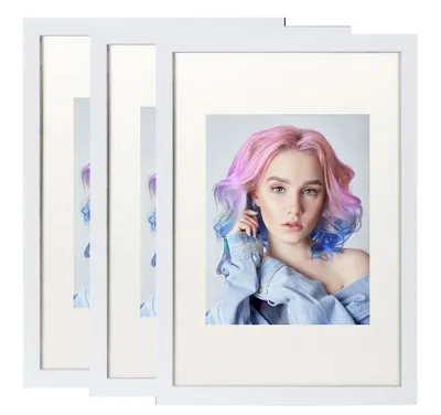 Three white picture frames are displayed side-by-side, with the rightmost frame showcasing a portrait of a young woman with colorful hair.
