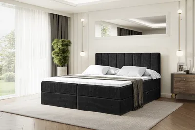 A bedroom scene with a large bed as the focal point.