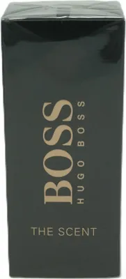 A close-up of a dark green box for Hugo Boss The Scent men's fragrance.