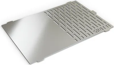 A silver metal grill plate with cutouts and a brand name is shown on a white background.