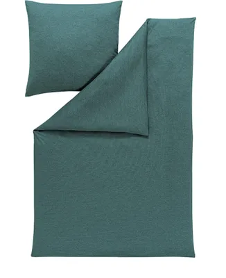 A flat lay of a duvet cover and a pillowcase, both in a teal color.