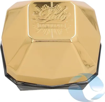 A close-up, top-down view of a gold-colored perfume bottle with faceted sides.