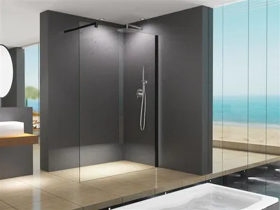 A modern bathroom with a walk-in shower and a view of the ocean.