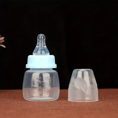 Produktbild von -freies 60 ml Babyfläschchen mit breitem Mundstück und ohne Griff, in Rosa/Blau erhältlich, für Säuglinge und Kleinkinder.