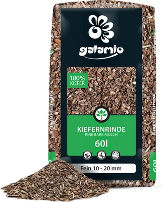 A bag of pine bark mulch with a pile of the product in front of it.