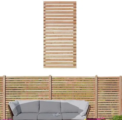 A wooden fence panel is shown above a section of fence with a sofa in front of it.