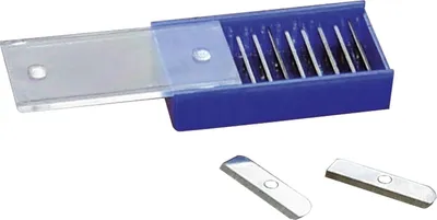 A set of replacement blades for a pencil sharpener, shown in a blue plastic case with a clear lid, and two loose blades in the foreground.