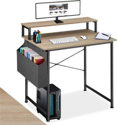 A computer desk with a monitor, keyboard, mouse, and storage bin.
