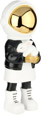 A decorative figurine of an astronaut holding a white rabbit.