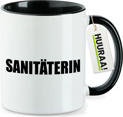 Produktbild von Huuraa Kaffeetasse Sanitäterin Schriftzug 330ml Schwarz Keramik Kaffeebecher Geschenkidee