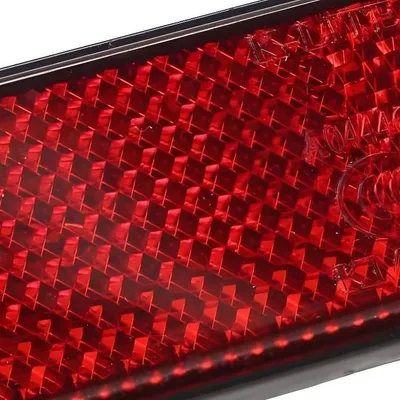 Obrázok produktu pre Reflektor 94x28mm červený M5 skrutkovateľný
