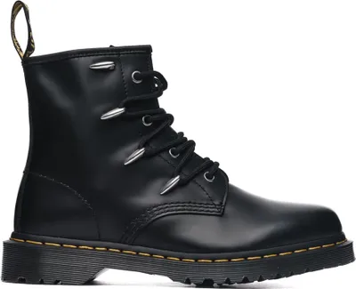 A black Dr. Martens boot with silver eyelets and laces.