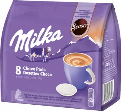 A bag of Milka Choco Pads with a cup of hot chocolate and a single pad shown.