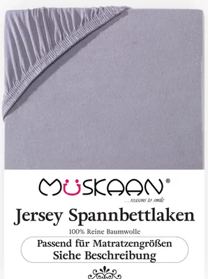 A close-up view of a gray jersey fitted sheet, showing the elasticized corner.
