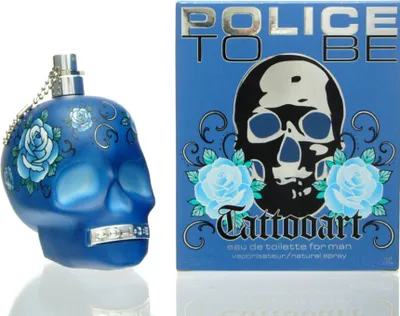 A blue skull-shaped perfume bottle and its packaging are displayed side-by-side against a white background.