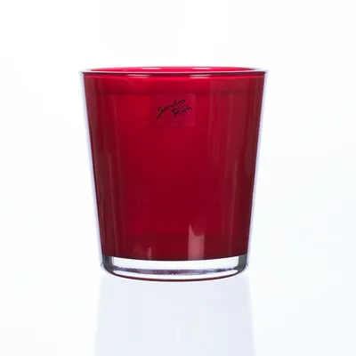 A red glass vase on a white background.