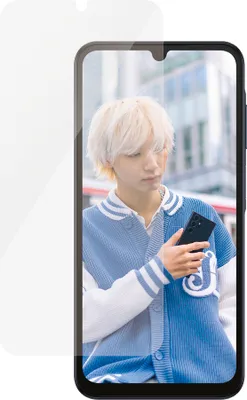 A person is holding a smartphone with a screen protector on it.