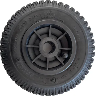 A close-up, front-facing view of a black pneumatic tire with a black plastic rim, isolated on a white background.