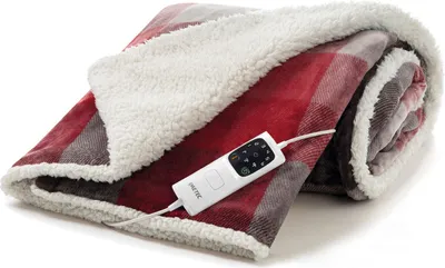 A folded heated blanket with a controller attached.
