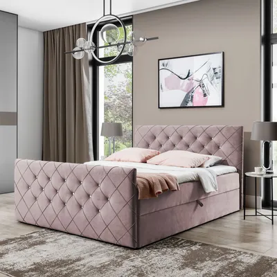 A bedroom scene featuring a pink upholstered boxspring bed.