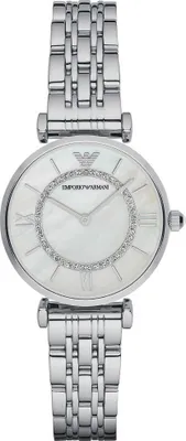 A close-up, studio shot of a women's wristwatch against a white background.