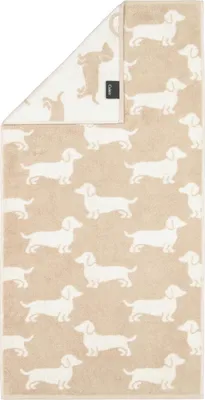 A folded towel with a pattern of dachshunds.
