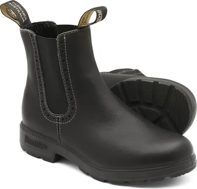 A pair of black leather Chelsea boots are shown against a white background.