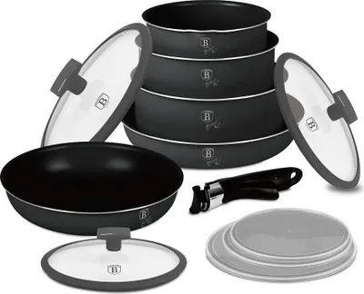 A collection of cookware items, including pots, pans, and lids, arranged on a white background.