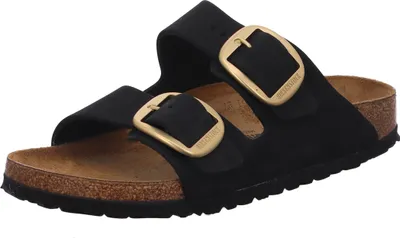 A pair of black Birkenstock Arizona Big Buckle sandals with gold buckles, shown from a front-side angle on a white background.
