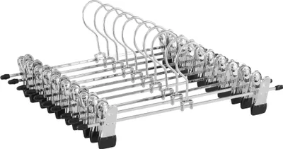 A group of metal hangers with clips for clothes.