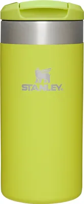 A studio shot of a green Stanley travel mug.
