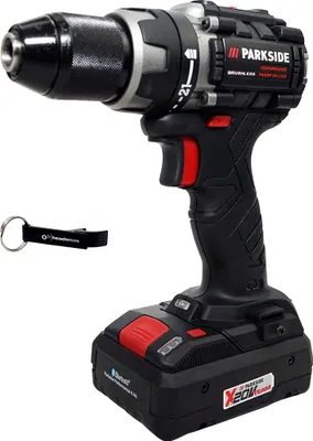 A cordless drill with a battery pack and a keychain, presented against a white background.