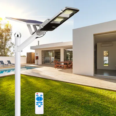 A solar-powered street lamp is shown in a backyard setting with a swimming pool and a modern house.
