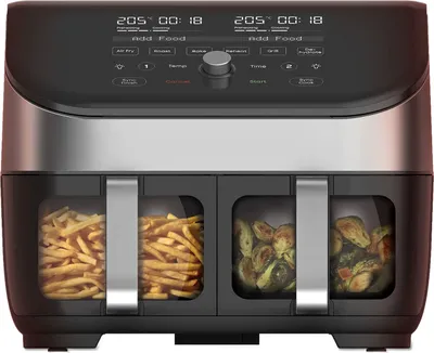 A front view of a dual air fryer with food in its compartments.