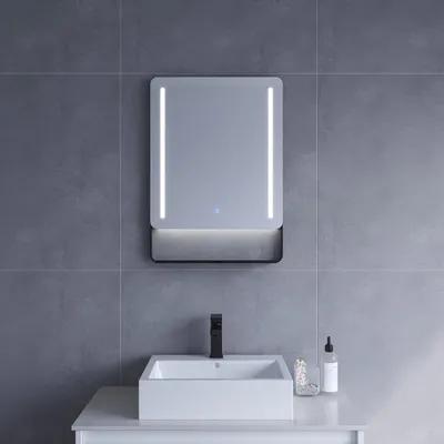 A bathroom sink with a mirror above it.