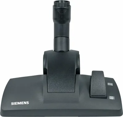 A close-up studio shot of a black vacuum cleaner floor nozzle.