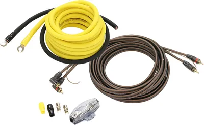 A car audio installation kit with various cables and a fuse holder.
