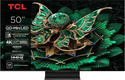 A TCL television displaying a vibrant, abstract image of a green, jewel-encrusted butterfly-like design.