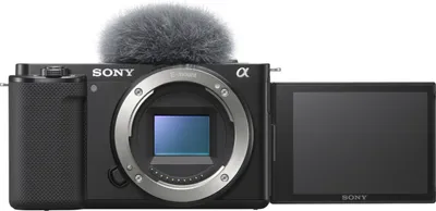 A black Sony Alpha ZV-E10 camera with a microphone attached is shown from the front with the screen flipped out.
