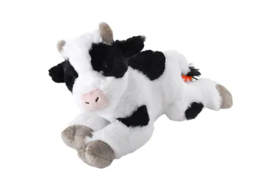 A plush toy cow lying down on a white background.