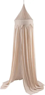 A beige mosquito net hanging from a single point.