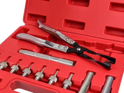 A red plastic case containing a set of automotive tools, specifically for valve stem seals.