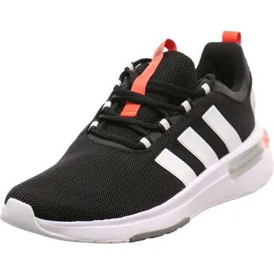 A black Adidas sneaker with white stripes and orange accents on a white background.