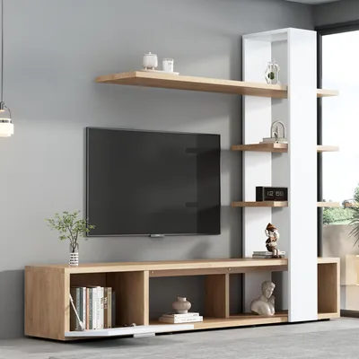 A modern living room entertainment center with a TV and shelving.