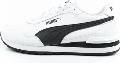 A side view of a white Puma sneaker with black accents.