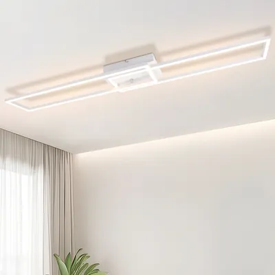 A modern white rectangular ceiling light fixture with integrated LED lighting, mounted on a white ceiling.