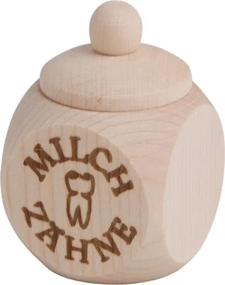 A small, wooden container with a lid, designed to hold baby teeth.